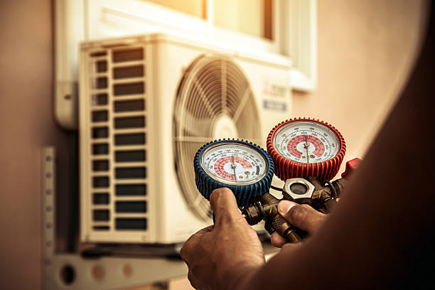 Professional Air Conditioning Service technician working in North Attleboro, MA
